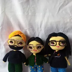 I love creating entire family sets. Here is a custom crochet family portrait, with each member designed based on photos to capture their individual look and style.