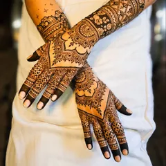 This engagement mehndi shows how I balance dense patterns on the forearm with delicate work on the fingers, creating a rich and detailed look.