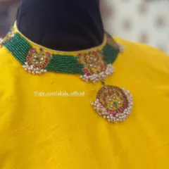 A blouse designed with a choker-style neckline that mimics the look of a necklace, showing another way I create built-in accessories.