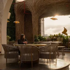 Sunset at Nido is a magical experience. We designed the space with a retractable roof and open sightlines to make the most of the city skyline, creating a perfect backdrop for an evening out.