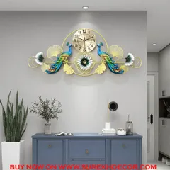 A beautifully balanced design, this antique metal wall clock features two peacocks flanking a central timepiece. The elegant form and artistic details create a sophisticated and harmonious focal point above a console table or in a hallway.