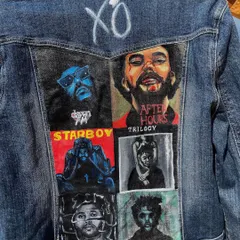 Another look at the custom 'XO' fan jacket. This angle highlights the composition of the six painted album portraits on the back of the classic blue denim.