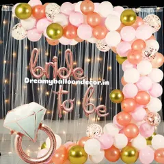 I create stunning, Instagram-worthy backdrops for 'Bride to be' parties. This popular rose gold theme features a full balloon arch with confetti and chrome accents, a shimmery curtain, and a giant diamond ring foil balloon for the perfect photo opportunity.
