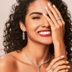 A classic beauty shot from a campaign for Aukera Jewellery. The focus here was on creating a joyful and radiant look with glowing skin, a bold red lip, and defined eyes that make the diamonds and the model's smile shine.