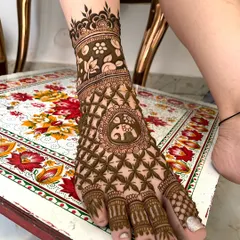 A stunning full-coverage foot design. The pattern features a central elephant motif surrounded by a dense 'jaal' net, extending all the way to the toes.
