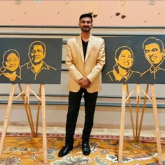 Standing proudly with the two completed glitter portraits. Each one was created as a surprise for the respective couples to celebrate their 25 years together, a memory they can now keep forever.