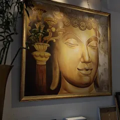 A large, golden Buddha painting can bring a sense of peace and grandeur to any space. This piece, with its serene expression and warm tones, is a favorite among our collectors for creating a meditative environment.