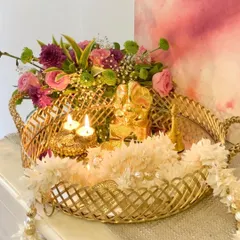 This luxurious gold mirror serving tray, with its delicately handcrafted jail rim, is perfect for creating a stunning display for pujas, festivals, or as a base for an opulent gift hamper.