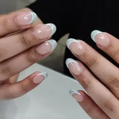 A cool and refreshing take on the French manicure with light blue tips and a delicate white accent line. This design is clean, simple, and effortlessly stylish.