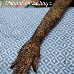 A complete bridal arm design that showcases a variety of techniques. From the detailed finger work to the geometric patterns on the forearm and the floral motifs throughout, this is a true work of art.