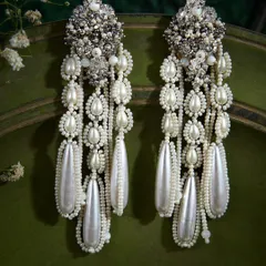 A throwback to our record-breaking bestsellers. These festive pearl danglers are still one of our most-loved designs, perfect for making a statement at any wedding or celebration.