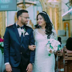 The couple walks down the church aisle as husband and wife, sharing a look of love and happiness.