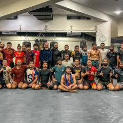Gurgaon Strong. A group photo of our fight team, a diverse group of killers united by the grind. This is the heart of our academy.