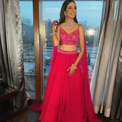 This is what a dream engagement look is made of. I styled Rhea in this vibrant fuchsia pink lehenga with an embroidered crop top and a delicate diamond necklace, creating a look that is modern, fresh, and absolutely stunning.