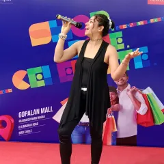 Singing my heart out while hosting an International Karaoke Day event at Gopalan Mall. I love events that involve music and performance, and I am always ready to jump in and participate.