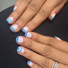 The evil eye design is so popular, and I love creating different versions of it. For this set, I hand-painted the symbol in shades of blue on a neutral base. This is a great way to have trendy and meaningful art right on your fingertips.