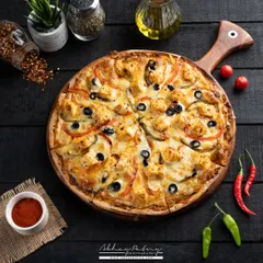 For this pizza, I created a dark, moody atmosphere to make the vibrant toppings and melted cheese the undeniable hero. The overhead angle, known as a flat lay, allows customers to see all the fresh ingredients at once, making it a perfect shot for menus and social media promotions.