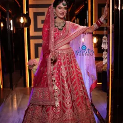 A magnificent full-length bridal portrait. We use dramatic lighting in this corridor shot to highlight the bride's entire look, from her stunning lehenga to her intricate jewelry.
