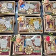 The same wooden gift hampers without the lights, showing the clarity and detail of the packaging. These are fully customizable and perfect for any occasion, including as wedding return favors.