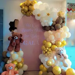 Welcome the little one with our adorable "We Can Bearly Wait" baby shower theme. This setup combines a custom pink backdrop with an organic balloon arch in pastel, brown, and gold tones, complete with cute teddy bear props for a heartwarming celebration.
