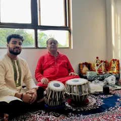 Seated beside my Guru with our tablas after the Guru Purnima ceremony.