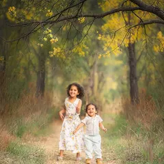 We love capturing the pure, unfiltered joy of childhood. This outdoor session in a beautiful wooded area was all about letting these siblings run, play, and just be kids, resulting in authentic, story-filled photographs.