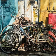 This 2019 watercolor of bicycles resting against a wall is a story told in rust and peeling paint. It’s a memory of a simple, everyday scene that holds a certain timeless beauty.