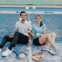 A creative shot with the couple juggling Padel balls, adding a touch of fun and action to their pre-wedding photos.
