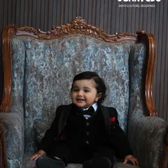 Seated like royalty. Our bespoke tuxedos are crafted to make your son feel special, with attention to every detail from the fit to the fabric.
