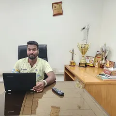 A lot of the most important coaching work happens off the field. Here I am in the office, analyzing game footage and planning tactical sessions. This preparation is vital for success.