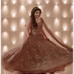 A beautiful, ethereal portrait of the bride, Kirti. The sepia tone and the motion of her twirling gown create a dreamy and timeless image of bridal joy.