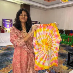 The bright, sunny colors on this tie-dye shirt perfectly match the creator's smile. It's a wearable piece of art and science.