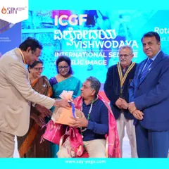 Another moment from the felicitation ceremony, where Chandru Sir is presented with gifts in recognition of his achievements. His work is a testament to the impact a dedicated yoga teacher can have.
