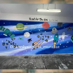 When she asks for space, I paint the entire galaxy! This space-themed mural is filled with planets, asteroids, rockets, and a friendly astronaut, with the inspiring quote "Reach for the stars."