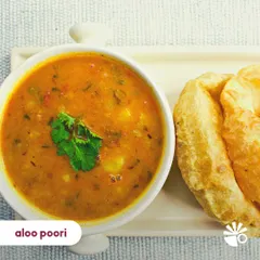 Piping hot Aloo Poori is pure joy on a plate. Fluffy, crispy pooris served with a tangy and flavorful potato curry. This is a weekend-worthy breakfast you can enjoy any day of the week.