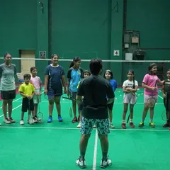 A coach addressing our junior batch. We believe in clear communication and setting expectations right from the start of the training session.