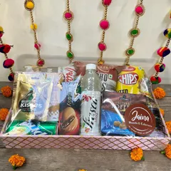 This Diwali hamper is perfect for those who love a mix of everything. It's loaded with chips, chocolates, cookies, juices, and more, making it a hit with all age groups.