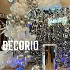 For a disco or glam themed bridal shower, this silver shimmer wall is a showstopper. I used a cascade of silver and white balloons, star-shaped foil balloons, and a mirrored pedestal to complete the high-energy, celebratory look.