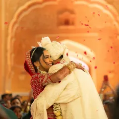 A moment of pure emotion as Vedika and Shubhang share a heartfelt hug after their ceremony, with rose petals falling around them. This is the candid, story-driven photography I love to capture.