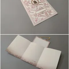 This handled invitation card features delicate laser-cut floral patterns on a soft pink background. The collage shows the exterior and the blank tri-fold insert ready for your message.