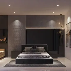 A moody and sophisticated bedroom design. The dark color palette, textured wall panels, and strategic lighting create an intimate and luxurious retreat, complemented by abstract art and metallic decor.