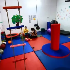Another angle of our therapy unit, showing the alphabet wall and various sensory tools. We create a rich environment that stimulates learning at every turn.