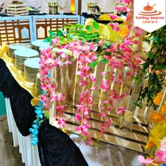 We believe presentation is just as important as the food. For this wedding reception, we used rustic wooden crates and vibrant floral arrangements to create a unique and visually appealing buffet display.