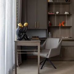 This workspace, with its custom desk and integrated shelving, reflects our commitment to precision and conscious creation. Every piece is designed to be both beautiful and functional, tailored to the specific needs of the user and the space.