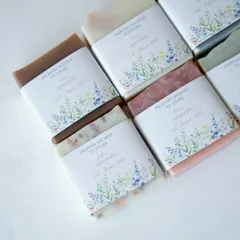A closer look at the custom labels for Akanksha's baby shower favors, featuring a beautiful floral design.