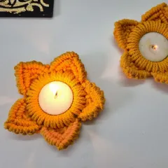 Two of my orange flower tealight holders, creating a beautiful, warm ambiance. They make wonderful gifts for the festival of lights.