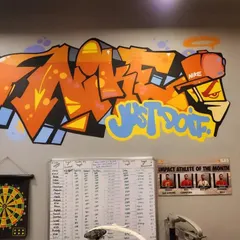 A classic graffiti piece with the "Just Do It" slogan for a Nike factory outlet in Gurgaon. We captured the brand's energetic spirit with bold, overlapping letters and a character illustration.