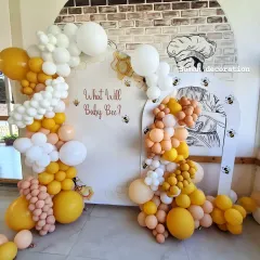 A wider shot of the "Baby Bee" themed decoration, showing the full arch of the backdrop and the playful arrangement of the balloons.