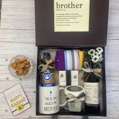 For the brother who deserves it all. This gift box features a quirky "This is one awesome brother" mug, shower gel, a scented candle, and snacks, complete with a heartfelt Rakhi card.
