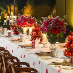 A tablescape should be a feast for the eyes. For this festive dinner, I used rich scarlet and burgundy tones, pomegranates, and glowing candles to create a warm, romantic, and luxurious atmosphere that invites guests to linger.